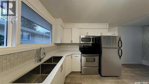41 Cartier Crescent, Saskatoon, SK - Indoor Photo Showing Kitchen With Double Sink