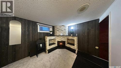 41 Cartier Crescent, Saskatoon, SK - Indoor Photo Showing Other Room With Fireplace