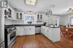 Bright kitchen with hardwood floor - 