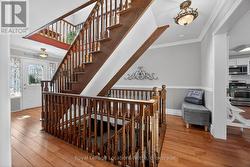 Wrap around oak staircase connecting 3 floors! - 