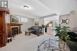 Rec room in basement with gas fireplace - 