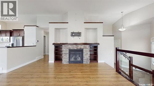 5614 Beacon Place, Regina, SK - Indoor Photo Showing Living Room With Fireplace