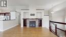 5614 Beacon Place, Regina, SK  - Indoor Photo Showing Living Room With Fireplace 