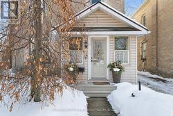 Enclosed porch entry with unique curved ceiling - 