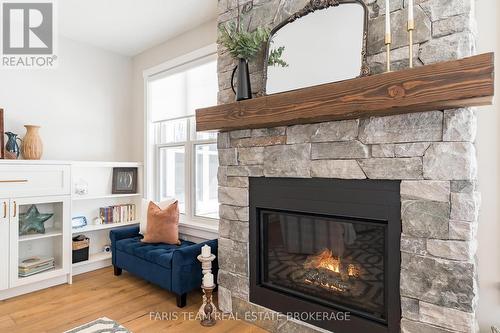 1555 Baseline Road S, Tiny, ON - Indoor Photo Showing Living Room With Fireplace