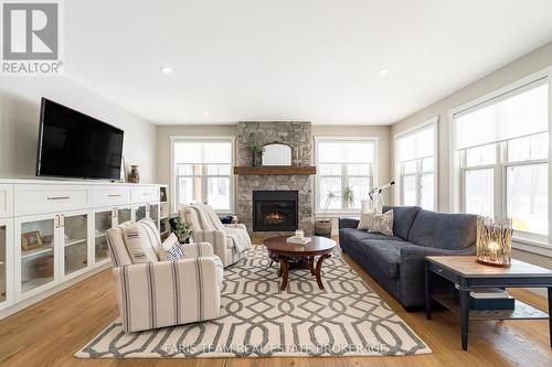 1555 Baseline Road S, Tiny, ON - Indoor Photo Showing Living Room With Fireplace