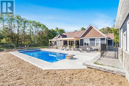 1555 Baseline Road S, Tiny, ON - Outdoor With In Ground Pool With Deck Patio Veranda