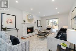 Spacious family room w fireplace & walkout to deck - 