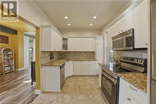 Stainless steel fridge & stove (2024) - 81 Ottawa Street N, Hamilton, ON - Indoor Photo Showing Kitchen