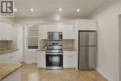 Stainless steel fridge & stove (2024) - 81 Ottawa Street N, Hamilton, ON - Indoor Photo Showing Kitchen With Stainless Steel Kitchen