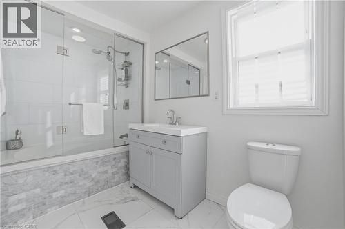 Soaker tub & 12x24 ceramic tiles - 81 Ottawa Street N, Hamilton, ON - Indoor Photo Showing Bathroom