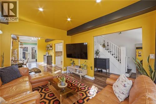 Enjoy street views from two private balconies! - 81 Ottawa Street N, Hamilton, ON - Indoor Photo Showing Living Room