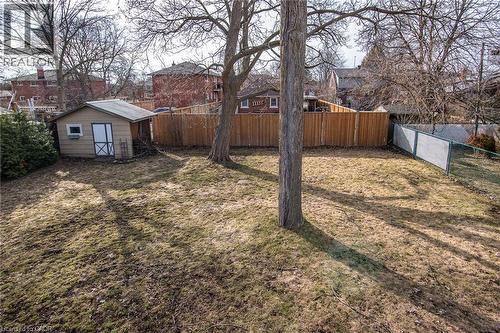 Fenced backyard with an outdoor structure - 120 Fourth Avenue, Kitchener, ON 