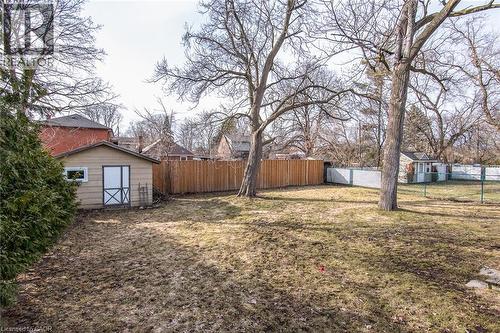 Fenced backyard with an outdoor structure - 120 Fourth Avenue, Kitchener, ON 