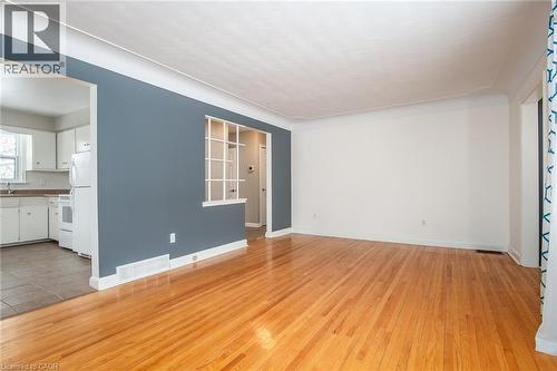 Unfurnished living room with light wood-type flooring and baseboards - 120 Fourth Avenue, Kitchener, ON 
