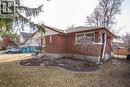 View of side of home with brick siding and a shingled roof - 120 Fourth Avenue, Kitchener, ON 