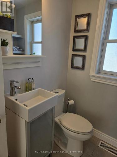 Mirror above the sink has convenient shelving! - 1305 Kingston Avenue, Ottawa, ON - Indoor Photo Showing Bathroom