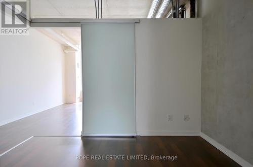 Bedroom 1 - 312 - 38 Joe Shuster Way, Toronto, ON - Indoor Photo Showing Other Room