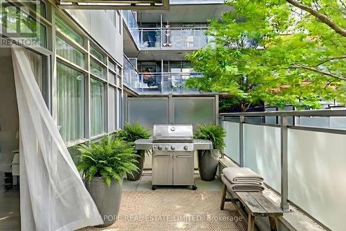 Virtual Staging - Terrace looking east - 312 - 38 Joe Shuster Way, Toronto, ON - Outdoor With Exterior