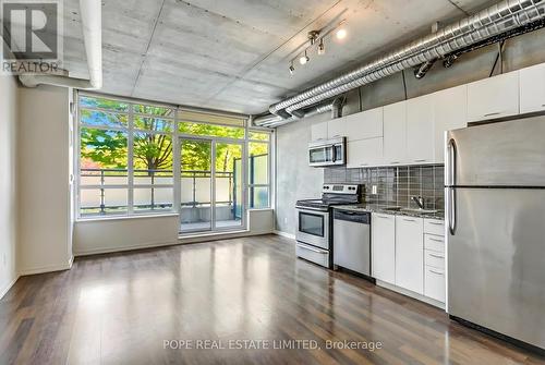Living Room 2 - 312 - 38 Joe Shuster Way, Toronto, ON - Indoor Photo Showing Kitchen With Stainless Steel Kitchen