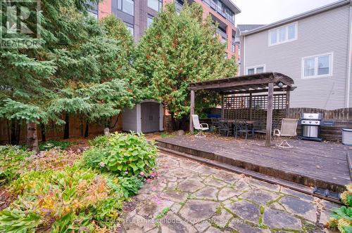 Flagstone patio, lush greenery, pergola and shed. - 118 Robinson Avenue, Ottawa, ON - Outdoor With Deck Patio Veranda