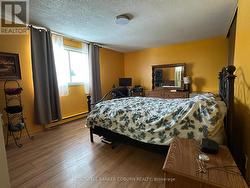 Primary bedroom with laundry. - 