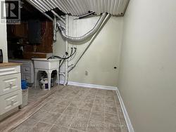 Laundry and utility room in lower level. - 