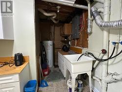 Laundry and utility room in lower level. - 