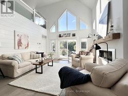 Window Wall Overlooking Pond & Propane Fireplace. - 