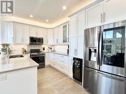 Kitchen with Quartz Countertops and S/S Appliances - 