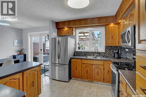 1245 Runciman Crescent N, Regina, SK - Indoor Photo Showing Kitchen With Double Sink