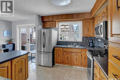 1245 Runciman Crescent N, Regina, SK - Indoor Photo Showing Kitchen With Double Sink