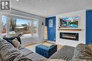 1245 Runciman Crescent N, Regina, SK  - Indoor Photo Showing Living Room With Fireplace 