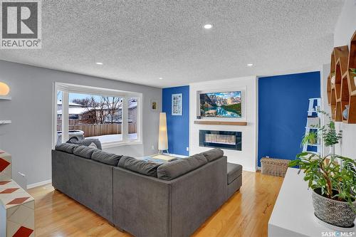 1245 Runciman Crescent N, Regina, SK - Indoor Photo Showing Living Room With Fireplace