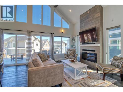 6742 Marbella Loop Unit# 302, Kelowna, BC - Indoor Photo Showing Living Room With Fireplace