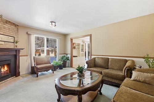 Salle familiale - 124 Rue Stéphanie, Dollard-Des-Ormeaux, QC - Indoor Photo Showing Living Room With Fireplace