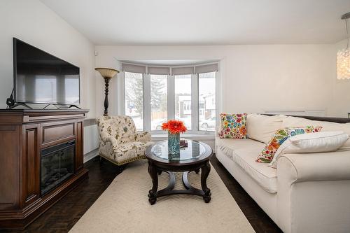 Living room - 360 Rue Proteau, Saint-Eustache, QC - Indoor Photo Showing Living Room With Fireplace