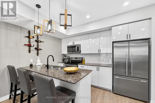 107 - 1206 Main Street E, Milton, ON - Indoor Photo Showing Kitchen With Double Sink With Upgraded Kitchen