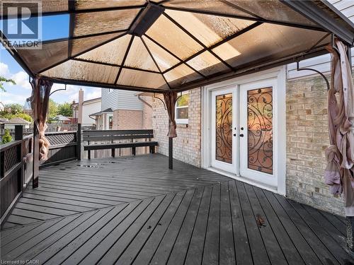 Wooden deck featuring a gazebo and french doors - 24 Keefer Road, Thorold, ON - Outdoor With Deck Patio Veranda With Exterior