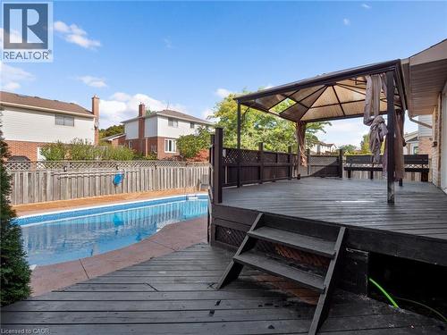 Wooden terrace with a fenced in pool, a gazebo, and fence private yard - 24 Keefer Road, Thorold, ON - Outdoor With In Ground Pool With Deck Patio Veranda With Exterior