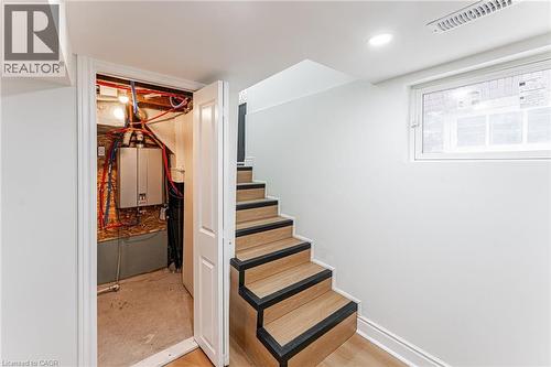 Separate side entry to self contained unit. Work from home or add rental income to help pay down your mortgage! - 15 Barnesdale Avenue N, Hamilton, ON - Indoor Photo Showing Other Room