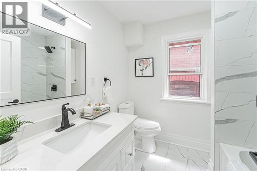 Lovely bathroom with vanity for storage, tile flooring & all new! - 15 Barnesdale Avenue N, Hamilton, ON - Indoor Photo Showing Bathroom