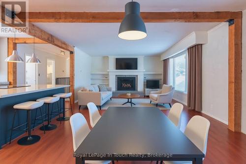 Virtually staged - 440 Concession Rd 16 Concession E, Tiny, ON - Indoor Photo Showing Dining Room With Fireplace