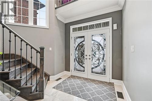 Entryway featuring french doors and ornamental molding - 456 Valridge Drive, Ancaster, ON - Indoor Photo Showing Other Room