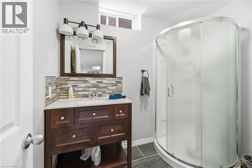 Bathroom with vanity, a shower stall, and decorative backsplash - 456 Valridge Drive, Ancaster, ON - Indoor Photo Showing Bathroom