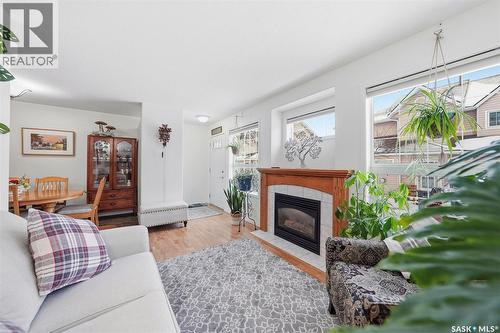 4 102 Willow Street, Saskatoon, SK - Indoor Photo Showing Living Room With Fireplace