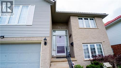 View of exterior entry with a garage - 44 Dunnigan Drive E, Kitchener, ON - Outdoor