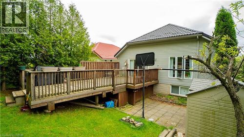 Rear view of property featuring a deck, a yard, and a patio area - 44 Dunnigan Drive E, Kitchener, ON - Outdoor With Deck Patio Veranda With Exterior