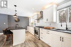 Slide in gas range and farm sink - 