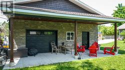 Covered porch area off detached garage - 
